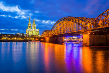 Night at the Cologne Cathedral with Hohenzollern Bridge in Colog