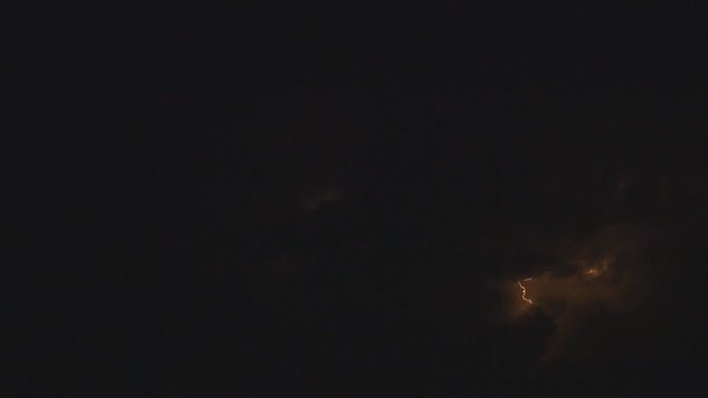 discharges and lightning against night storm clouds