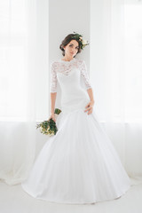 Beautiful happy young bride waiting for groom.