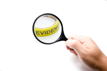 magnifying glass with yellow evidence in focus concept