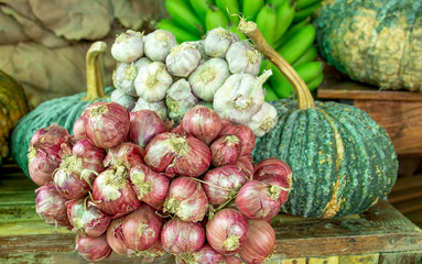 Various vegetables  garlic,red onion,green pumpkins and bananas