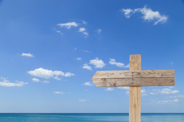 wooden signboard on blue sky for summer background with copy spa