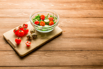 Summer salad: arugula, tomatoes, eggs, butter, spices