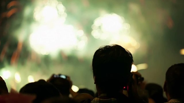 Watching Fireworks silhouetted crowd. Holiday backgrounds. Fireworks in the sky celebrating lunar new year.