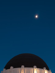 Venus and full moon rising high over Griffith Observatory