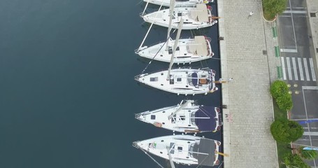 Aerial View Of Beautiful Small Town Sibenik, Croatia. View of buildings and the bay. Sailboats at the dock. Beautiful views of nature.