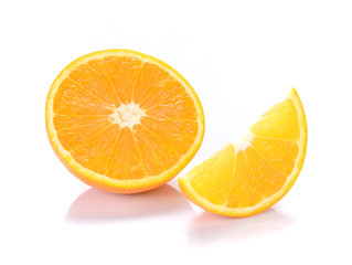 Orange cut pieces on white background.