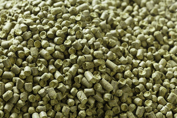 Closeup view of granule hop hopes. Ingredient for Industrial production of beer. Background...