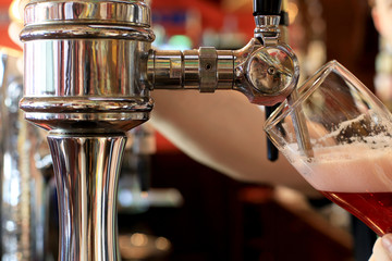 Chrome beer taps with highlights in the pub