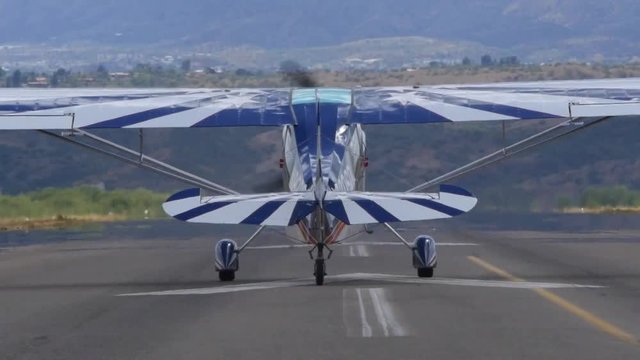 A small plane taking off at an airport