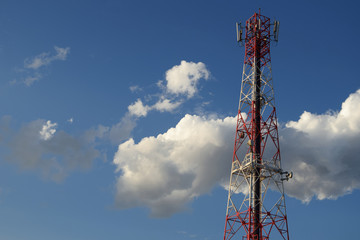 communications tower and satellite on blue sky.