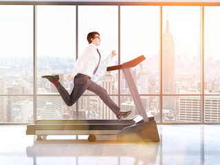 Businessman on treadmill toning