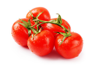 Ripe fresh cherry tomatoes on branch