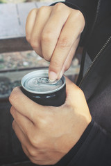 Fototapeta premium Cola can and hand