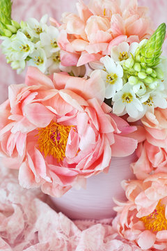 Floral composition with a pink peonies close-up.