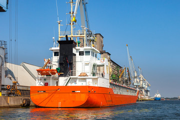 Ship loading cargo at port of Gdansk, Poland.