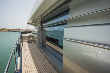 Side of a luxury yacht with panorama window