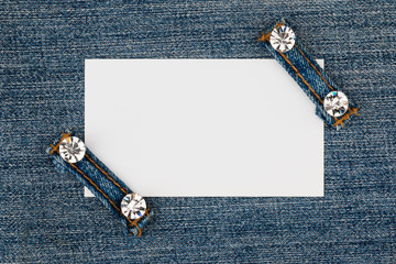 Business card with two straps  jeans, lies on the light denim - 109387858