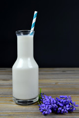 Milk bottle with striped straw