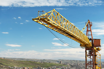 Crane tower against a blue sky