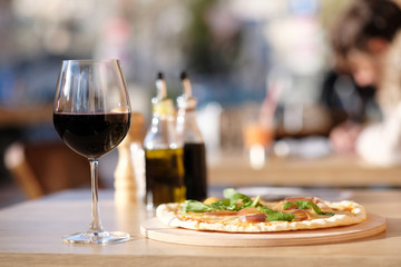 Pizza and red wine in restaurant