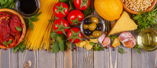 Italian food background - ingredients on wooden table.