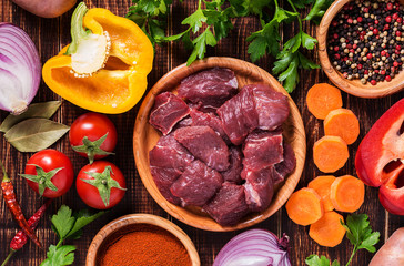 Ingredients for goulash or stew cooking: raw meat,herbs,spices.