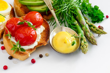 Hollandaise sauce in a spoon