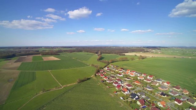 Aerial view of village and farm fields in spring