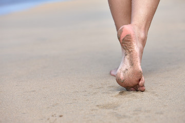 Woman walking on a beach