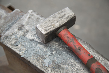 Hammer and anvil used by a blacksmith