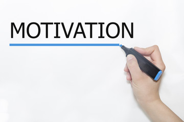 Hand writing motivation with marker on transparent wipe board.