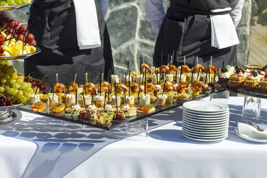 Catering Service. Meat, Fish, Vegetable Canapes On A Festive Wedding Table Outdoor. 