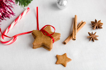 Christmas homemade gingerbread cookies and spice on white table, New Year decoration