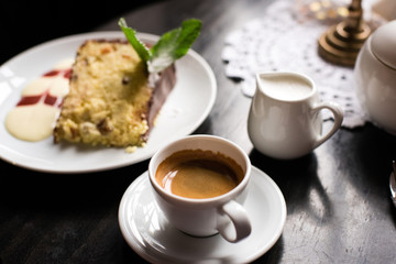 coffee cup and cake on wooden table