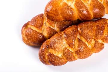 pile of fresh and delicious kroissants and rolls on a white back