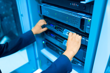 Man fix server network in data center room