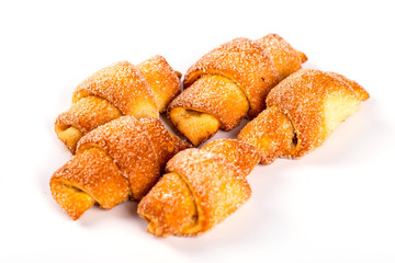 pile of fresh and delicious kroissants and rolls on a white back