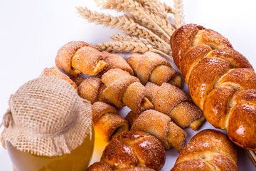 pile of fresh and delicious kroissants and rolls on a white back