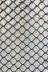 grunge background. rusty steel mesh on the background of cracked