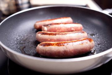 Sausages cooking