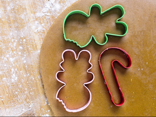 plastic cookie cutter on gingerbread dough.