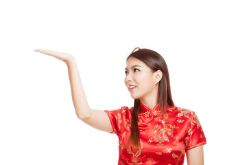 Asian girl in chinese cheongsam dress with  blank space on her h