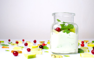 handmade yogurt with oranges on a white background