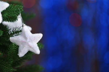 Christmas tree with decor on bright background, closeup