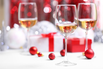 Wineglasses on red blurred lights background