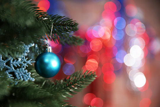 Christmas tree with decor on bright background, closeup