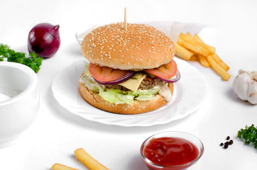 Burger topped with vegetables, spices and fries