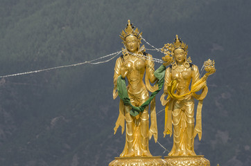 Statues of buddhist goddesses at top hill in Kuenselphodrang Nature Park, Thimphu, Bhutan - Goddesses statues at Buddha Dordenma site