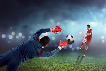 Man kick ball on the goalkeeper